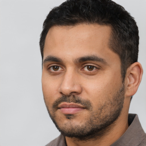 Neutral latino young-adult male with short  black hair and brown eyes