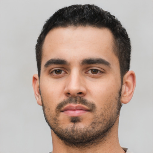 Neutral latino young-adult male with short  black hair and brown eyes