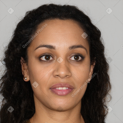 Joyful black young-adult female with long  brown hair and brown eyes