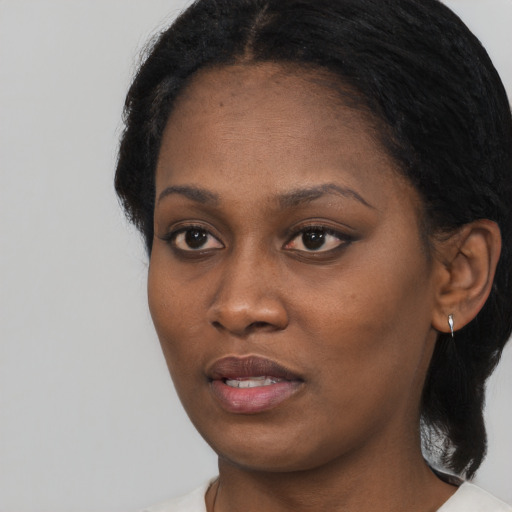 Neutral black young-adult female with long  black hair and brown eyes