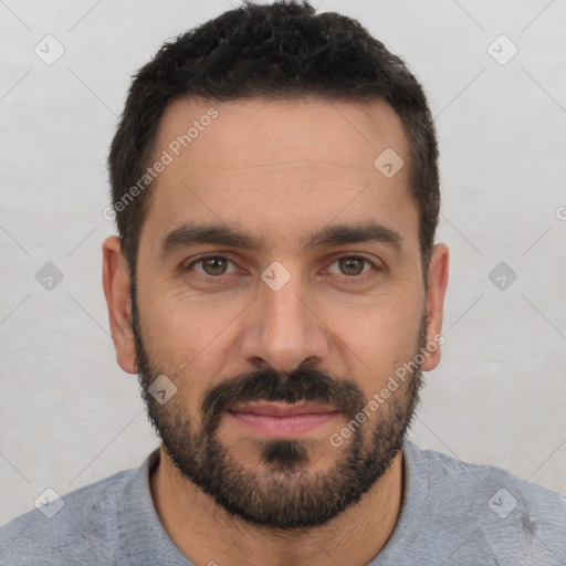 Joyful white young-adult male with short  black hair and brown eyes