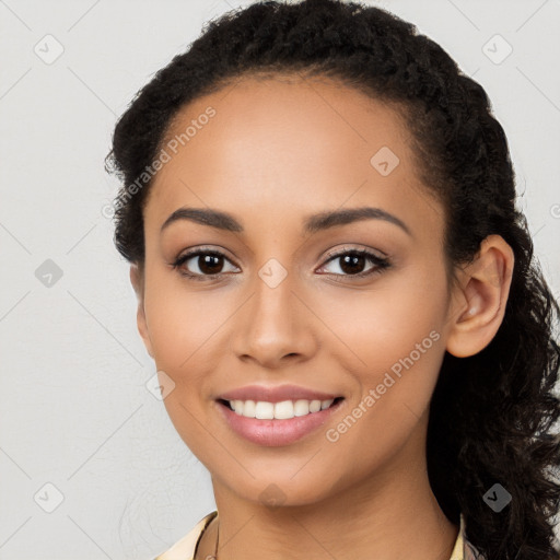 Joyful latino young-adult female with long  black hair and brown eyes