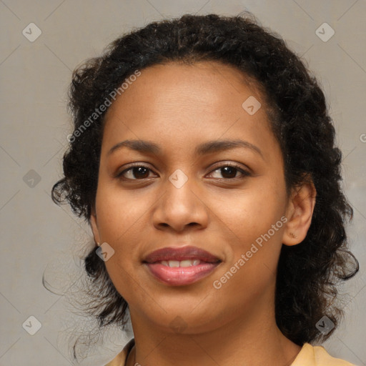 Joyful black young-adult female with medium  black hair and brown eyes