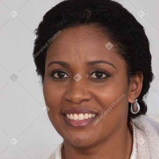Joyful latino young-adult female with short  black hair and brown eyes