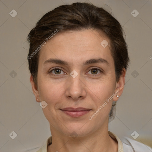 Joyful white adult female with short  brown hair and brown eyes