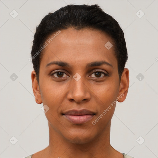 Joyful latino young-adult female with short  black hair and brown eyes