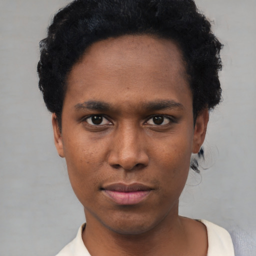 Neutral black young-adult male with short  black hair and brown eyes