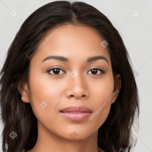 Joyful latino young-adult female with long  brown hair and brown eyes