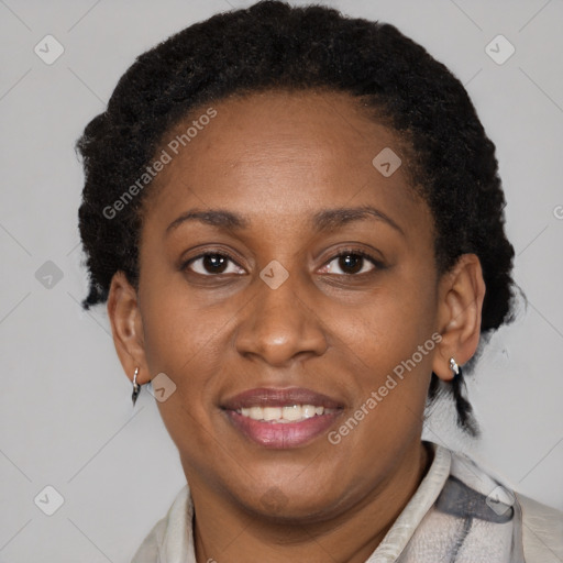 Joyful black adult female with short  brown hair and brown eyes