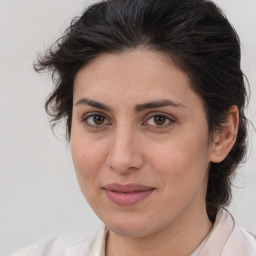 Joyful white young-adult female with medium  brown hair and brown eyes