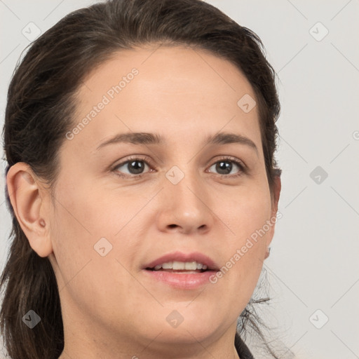 Joyful white young-adult female with long  brown hair and brown eyes