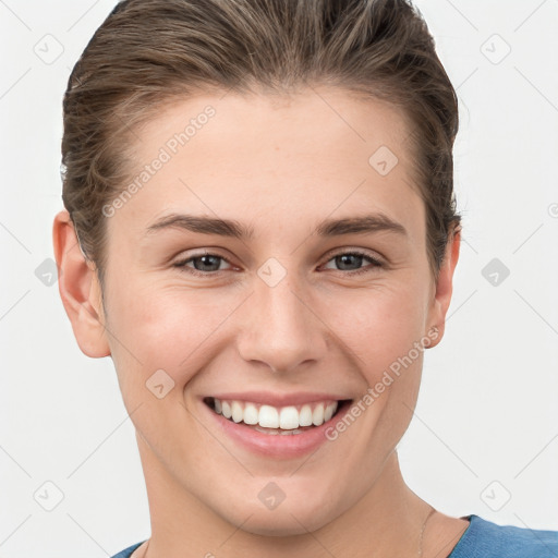 Joyful white young-adult female with short  brown hair and grey eyes