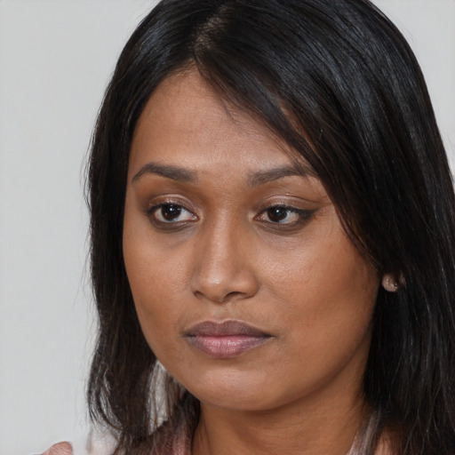 Neutral asian young-adult female with long  brown hair and brown eyes