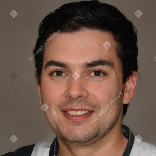 Joyful white adult male with short  brown hair and brown eyes