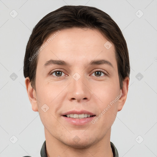 Joyful white young-adult male with short  brown hair and grey eyes