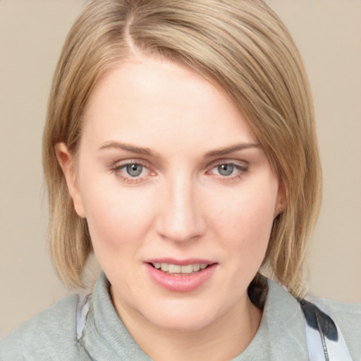 Joyful white young-adult female with medium  brown hair and blue eyes