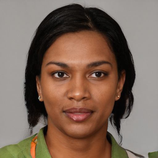 Neutral black young-adult female with medium  black hair and brown eyes