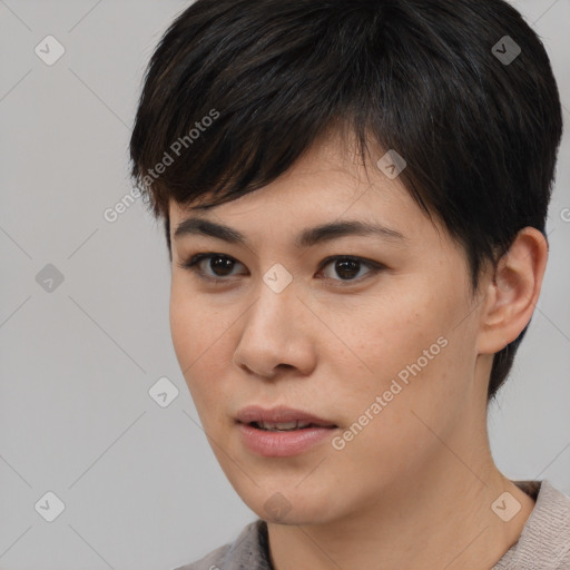 Joyful asian young-adult female with short  brown hair and brown eyes