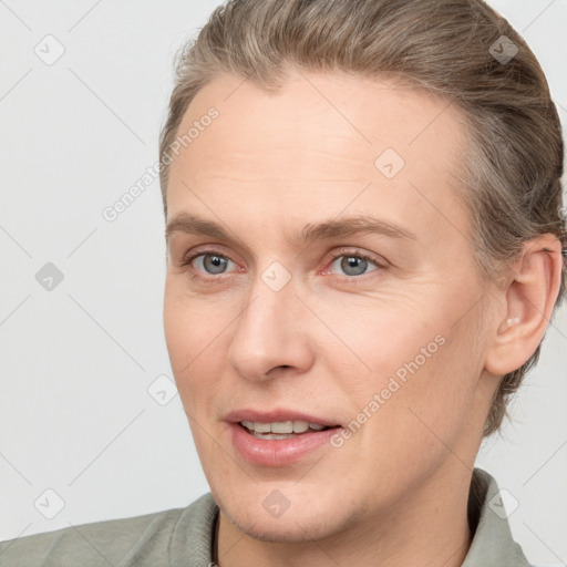 Joyful white adult female with short  brown hair and brown eyes