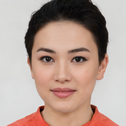 Joyful asian young-adult female with short  black hair and brown eyes