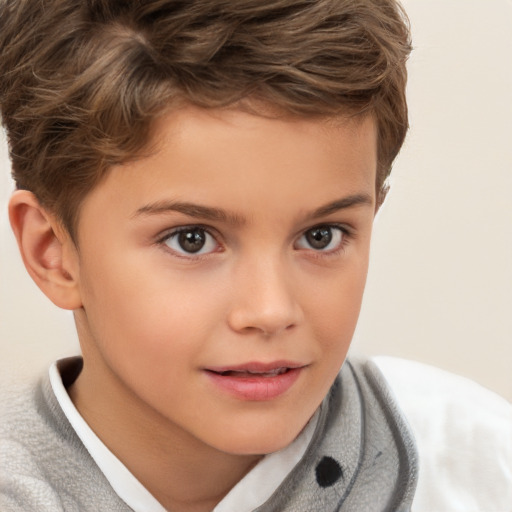 Joyful white child male with short  brown hair and brown eyes