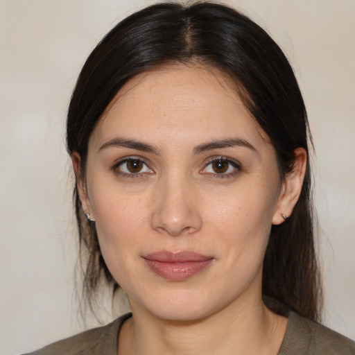 Joyful white young-adult female with medium  brown hair and brown eyes