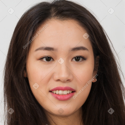 Joyful asian young-adult female with long  brown hair and brown eyes