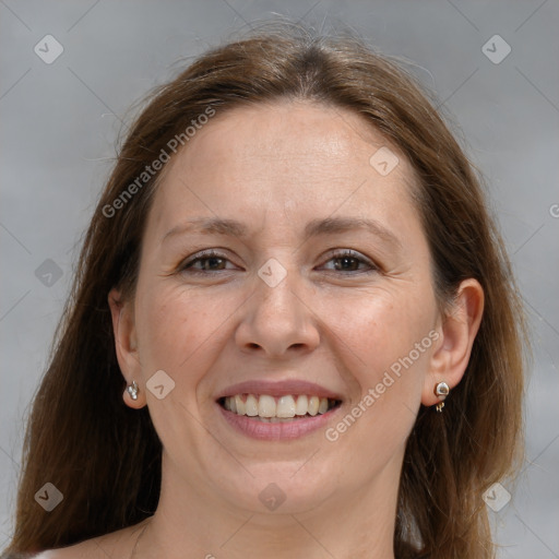 Joyful white adult female with medium  brown hair and grey eyes