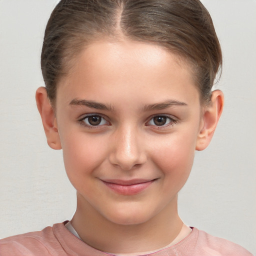 Joyful white child female with short  brown hair and brown eyes