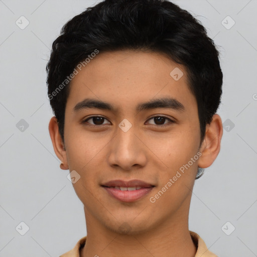 Joyful latino young-adult male with short  black hair and brown eyes