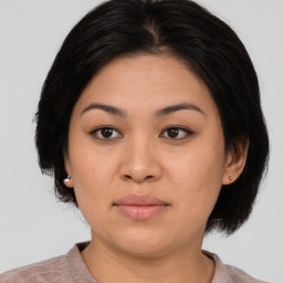 Joyful asian young-adult female with medium  black hair and brown eyes