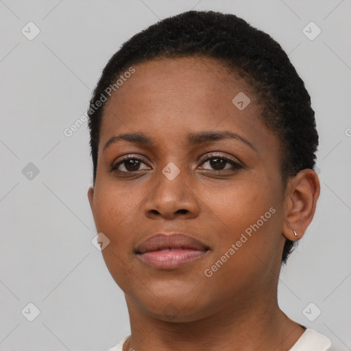 Joyful black young-adult female with short  brown hair and brown eyes