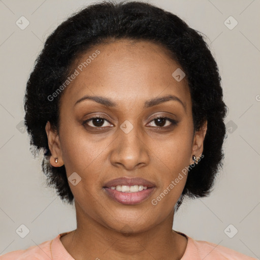 Joyful black young-adult female with medium  brown hair and brown eyes
