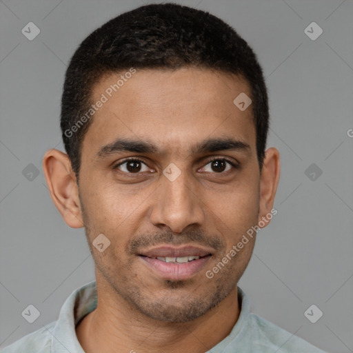 Joyful latino young-adult male with short  brown hair and brown eyes