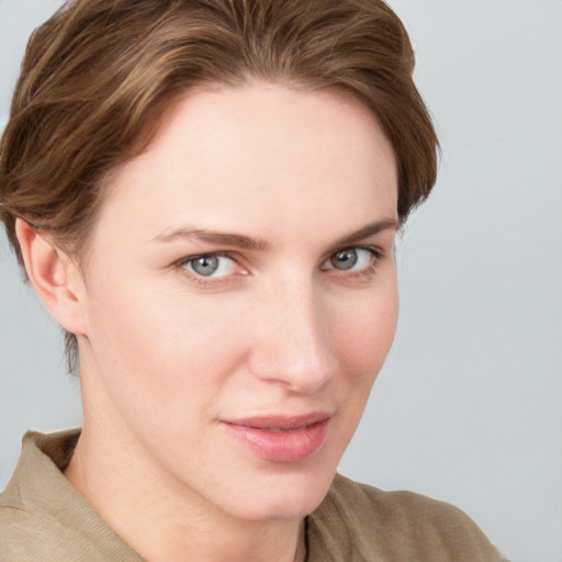 Joyful white young-adult female with medium  brown hair and blue eyes