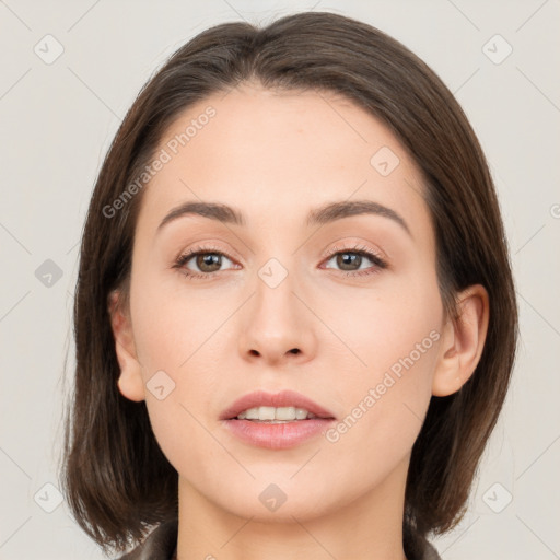 Neutral white young-adult female with medium  brown hair and brown eyes