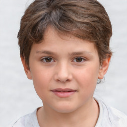 Joyful white child female with short  brown hair and brown eyes