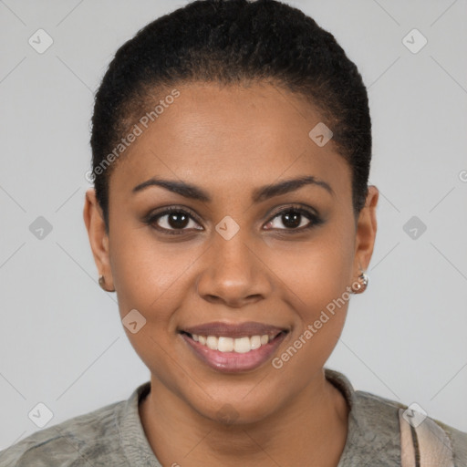 Joyful black young-adult female with short  black hair and brown eyes