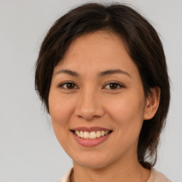 Joyful white young-adult female with medium  brown hair and brown eyes