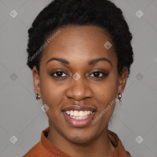 Joyful black young-adult female with short  black hair and brown eyes