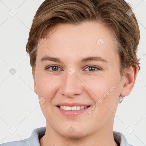 Joyful white young-adult female with short  brown hair and grey eyes