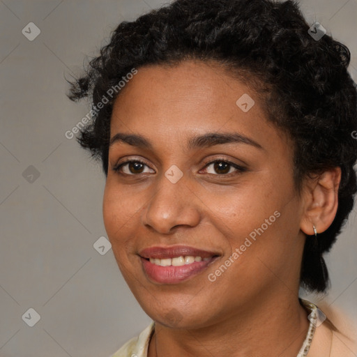 Joyful black young-adult female with medium  brown hair and brown eyes