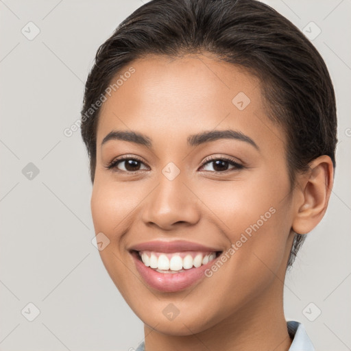 Joyful white young-adult female with medium  brown hair and brown eyes