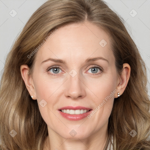 Joyful white adult female with long  brown hair and grey eyes