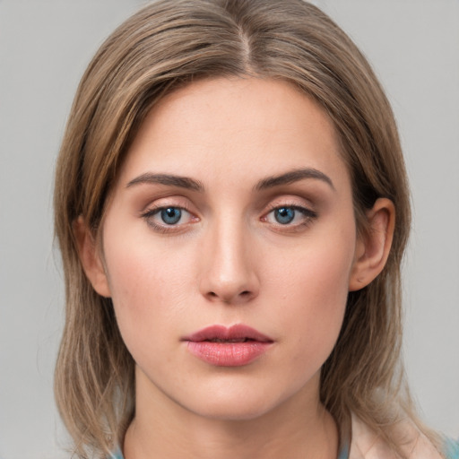 Neutral white young-adult female with medium  brown hair and grey eyes