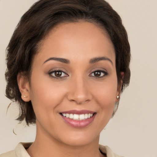 Joyful white young-adult female with medium  brown hair and brown eyes