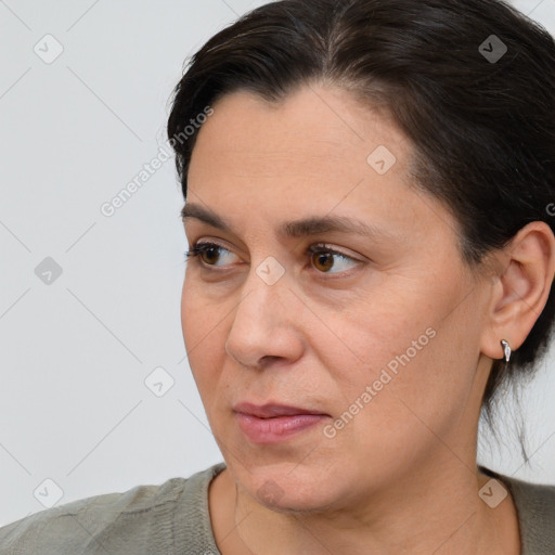 Joyful white adult female with short  brown hair and brown eyes