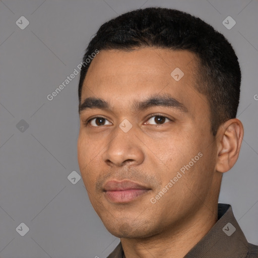 Joyful white young-adult male with short  black hair and brown eyes