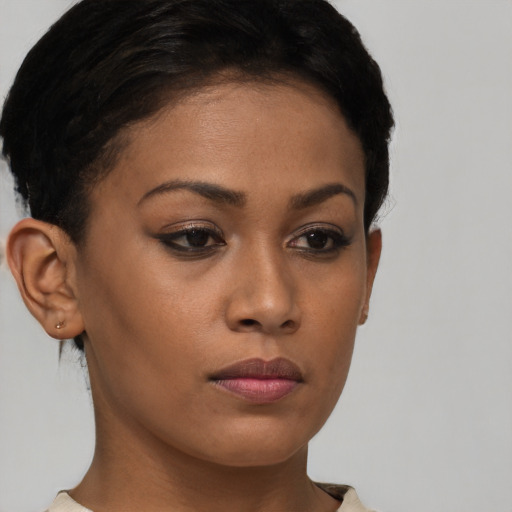 Neutral black young-adult female with short  brown hair and brown eyes