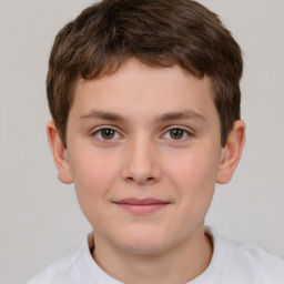 Joyful white child male with short  brown hair and brown eyes